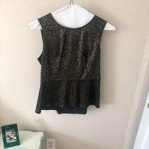 Peplum in gold and black.